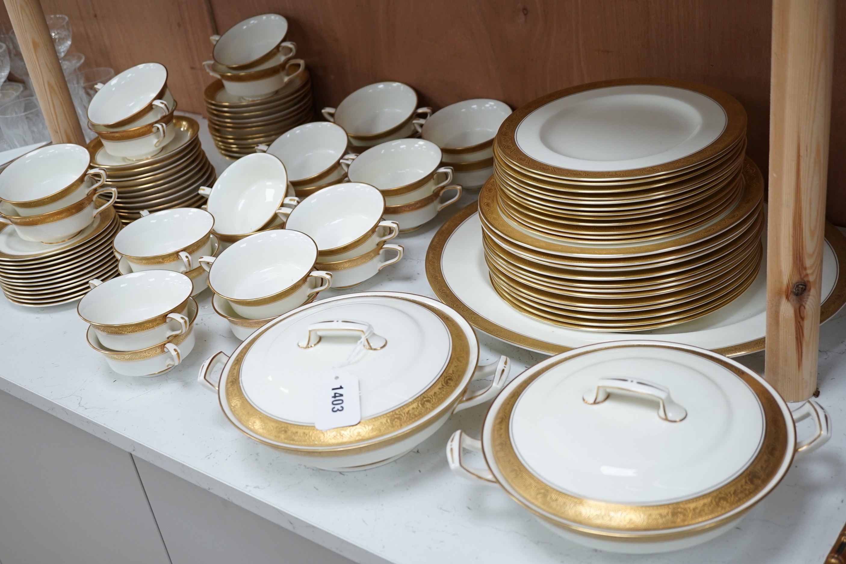 A Royal Worcester gilt edged part dinner service